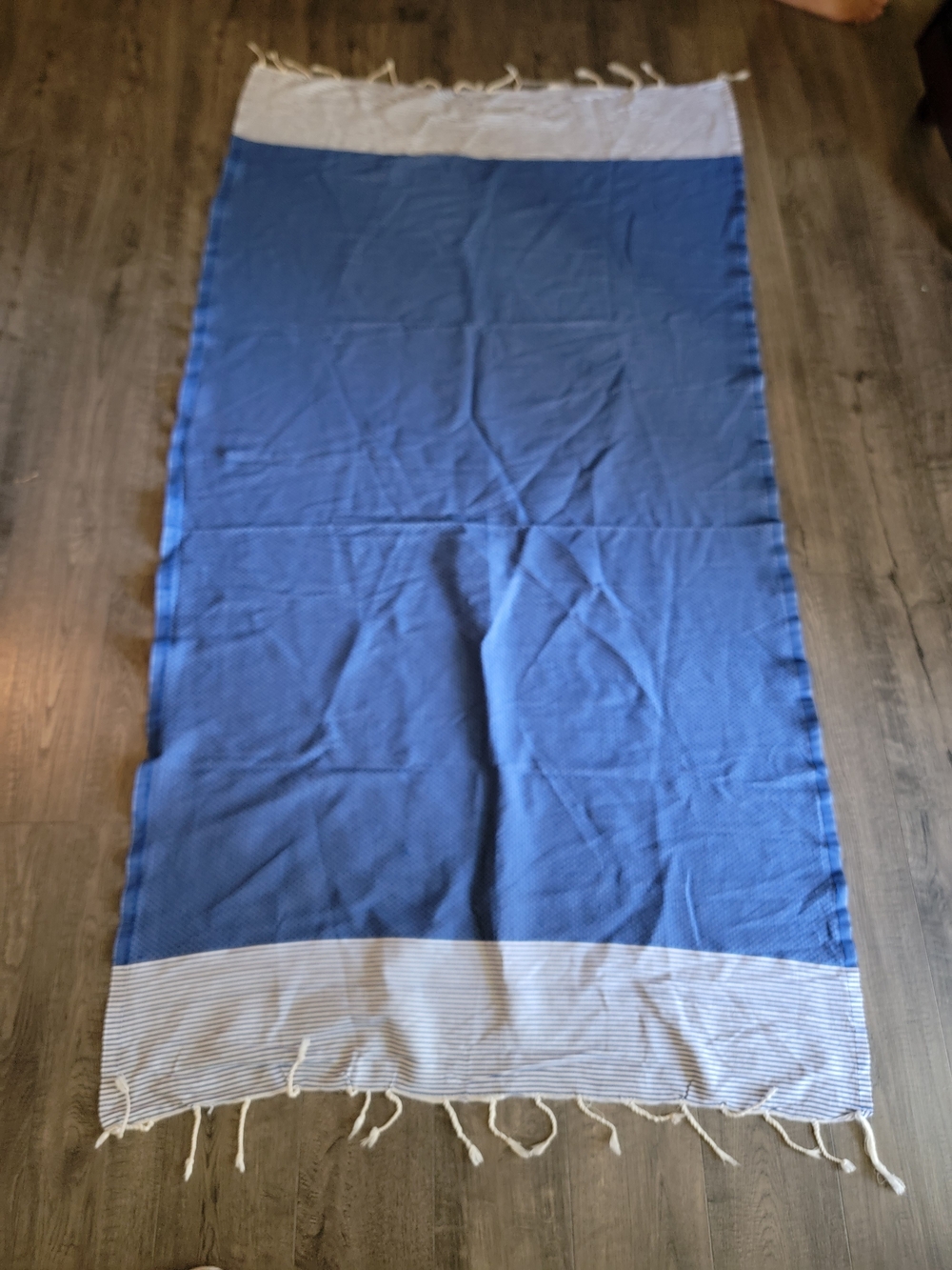 Fouta Du Sub, which is a lightweight, blue, and white Turkish-Style cotton towel